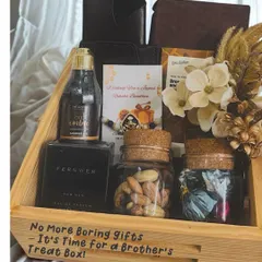 No more boring gifts for your brother this Raksha Bandhan. This wooden tray hamper is packed with his favorites: perfume, a shower gel, dry fruits, and chocolates, making it a treat box he'll actually love.