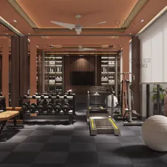 A wider view of the private home gym, showing the full range of equipment and the mirrored walls that make the space feel larger and more energetic.