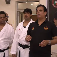 Hanshi Bharat Sharma, a respected figure in Indian karate, addressing our students during a seminar. His words of wisdom are invaluable.
