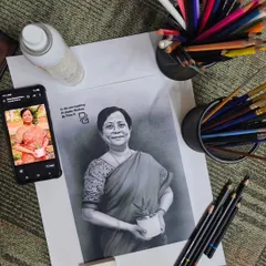 I believe art should capture the soul, not just the likeness. Here is a charcoal and pencil portrait I created, showing the final sketch next to the reference photo. I take great care to bring out the warmth and personality of every individual I draw.