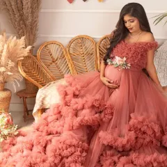 A stunning solo portrait in my boho setup. The ruffled pink gown provides a beautiful pop of color against the neutral, earthy tones of the background.