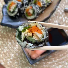 Introducing Korean Gimbap to my menu. This flavorful roll with fresh vegetables, kimchi, and tofu is a healthy and delicious taste of Korea for your party.