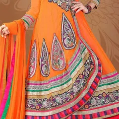 A bright orange Anarkali suit with intricate paisley embroidery. This style is perfect for functions where you want a grand and elegant look.