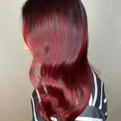 A side view of the Merlot Hair color. You can see the subtle face-framing highlights and the way the deep red and plum tones blend together seamlessly for a luxurious finish.