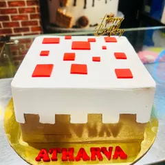 Another take on the popular Minecraft theme, this cake replicates a block from the game with redstone details. It's a simple yet instantly recognizable design for any gamer.