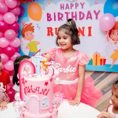 The birthday girl with her Barbie dreamhouse cake! Seeing smiles like this is the best part of my job.
