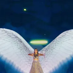 A bride's performance with interactive LED wings that create an angelic silhouette. This is a perfect example of how we use technology to create magical, personalized moments.