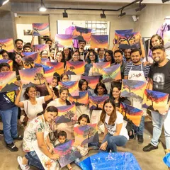 The whole crew from the Adidas workshop posing with their incredible sunset paintings. It was a full house and a night of unforgettable creative vibes.