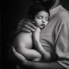 The tender bond between a father and his sleeping child. This black and white image has a quiet, profound feeling that is simply timeless.