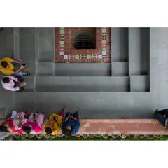 An overhead view of the stepped well at the ASA Office, designed as a community gathering space. This feature is a modern interpretation of a traditional Indian 'baori' and serves as a social heart for the building.
