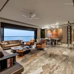In this 3,300 sq. ft. luxury residence in Shivaji Park, the living room unites understated elegance with refined functionality. The aesthetic draws from a timeless palette of marble flooring, soft-hued furnishings, and rich textures in veneer and stone, creating a visual and tactile rhythm.