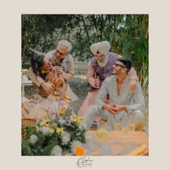 A candid moment of laughter and joy between the bride, groom, and their fathers. We styled the entire family in complementary pastel and neutral tones for a cohesive and elegant look.