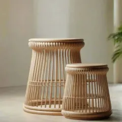 This set of two nesting rattan tables offers flexible functionality. Use them together for a layered look or separately where needed.