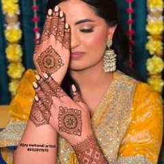 A happy client with a simple and elegant design on the back of her hands, perfect for guests at a wedding or a small function.