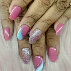 A sweet and girly design with plenty of sparkle. We combined solid pink nails with accent nails featuring a pop of baby blue and a full-coverage, multi-color glitter for a fun and glamorous look.