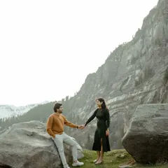 A stylish portrait set against the majestic mountains of Manali. The couple's connection is the focus, framed by the grandeur of the Himalayan landscape.