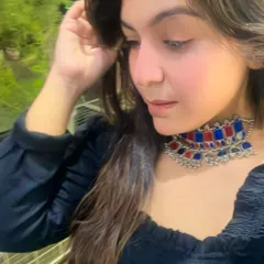 A close-up on this beautiful dual-toned choker necklace. A statement jewelry piece like this can instantly elevate a simple black top.