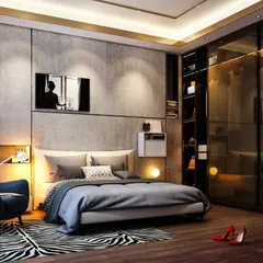 A moody and sophisticated bedroom featuring dark wood floors, a concrete-textured accent wall, and a glass-fronted wardrobe. The cozy armchair and warm lighting create a perfect reading spot.
