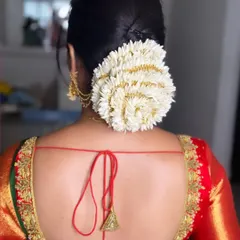 A simple and elegant jasmine flower bun for Chaitra. This is a timeless South Indian hairstyle that is perfect for any traditional event and smells divine.