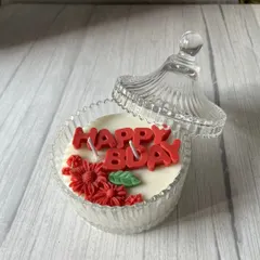 Our "Happy Bday" candles are a fun and festive gift. This one is set in a crystal jar and decorated with red floral wax embeds.