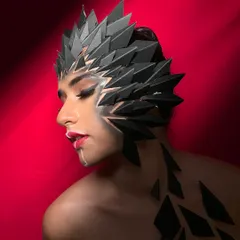 This fantasy look was built using custom-made geometric prosthetics to create a striking, sculptural effect. The makeup is kept minimal yet sharp to complement the headpiece, demonstrating my skill in both makeup application and special effects.