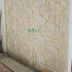 And here is the after. I filled the frames with a gold and beige marble-effect wallpaper, completely transforming the wall into a luxurious and elegant feature.