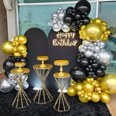 For a sophisticated adult birthday or anniversary, I created this chic black and gold balloon arch. The combination of metallic gold and deep black balloons, paired with a neon "Happy Birthday" sign, provides a glamorous and modern photo backdrop.