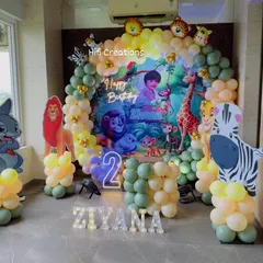 We bring the jungle to you with our popular Jungle Safari theme. This setup for a second birthday features a vibrant backdrop, themed balloon arch, light-up numbers, and life-sized cutouts of favorite jungle animals like lions, zebras, and monkeys.