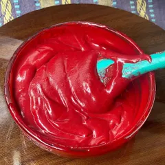 A close-up of the smooth, luscious red velvet brownie batter before it goes into the oven. Understanding batter consistency is a key part of baking science that I explain in detail during my live classes.