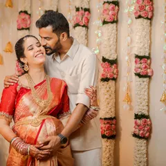 The joy and love between a couple are the heart of any baby shower. This candid shot captures a happy, loving embrace during a traditional Valaikaappu ceremony, showing the genuine connection we aim to photograph.