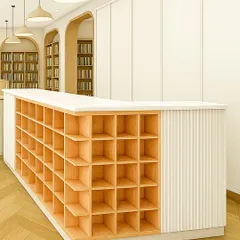 A close-up of the library's reception desk, featuring integrated cubby storage. This custom piece is both functional for organization and beautiful in its minimalist design, with clean lines and a contrast of wood and white.
