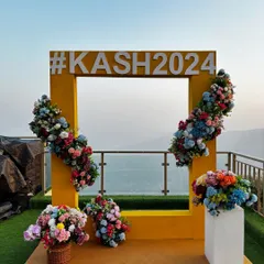 This photo booth is designed to be a fun and interactive element for guests, while also providing a beautiful memento of the wedding day.