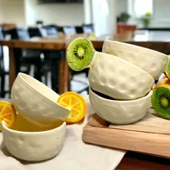 I love adding a playful twist to everyday items. These quirky, handmade bowls feature sculpted kiwi and orange slice handles, bringing a bit of fun and unique character to your kitchen and dining table.