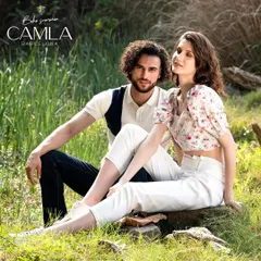 A couple-styled shot for Camla Barcelona's "Boho Summer" campaign. The looks are coordinated in a fresh white and navy palette, creating a romantic and aspirational image for the brand.