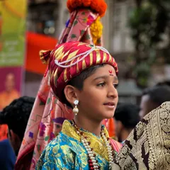 A young participant at the Gudi Padwa procession, carrying the Gudi. This shot captures the innocence and seriousness with which our traditions are upheld.