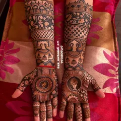A complete bridal set featuring portraits of the bride and groom, along with other traditional motifs like peacocks and floral bands.