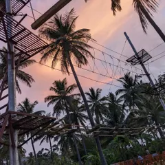 The rope adventure course set against a beautiful sunset sky. It's a different way to enjoy the view.
