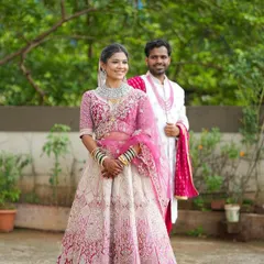 Your portfolio can also include couple shots to show how your makeup work fits into a complete wedding scene. Here is the same pink lehenga styled for a pre-wedding or wedding day shoot.