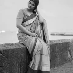 The same portrait, converted to black and white. Stripping away color helps focus on expression, mood, and the timeless quality of the moment. This is a powerful choice for creating classic, elegant portraits during a pre-wedding or solo shoot.