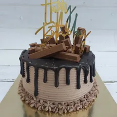 A birthday cake that's all about chocolate. This design is loaded with KitKat bars and has a rich dark chocolate drip over a lighter chocolate cream, offering a wonderful mix of textures and flavors.