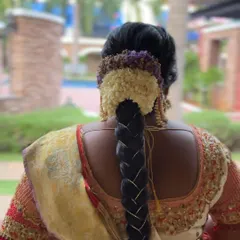 A detailed shot of Dr. Preetha's muhurtham braid. We used a mix of fresh florals and added rhinestone detailing for a touch of sparkle.