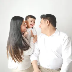 The best family portraits are the ones filled with genuine laughter. This candid moment in the studio, with everyone sharing a joke, is exactly the kind of authentic connection I love to capture.