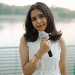 Holding a microphone like a flower. For me, singing is the most natural form of expression, as simple and beautiful as a blossom.