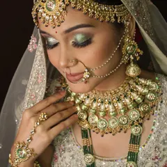 This is the perfection we strive for. A close-up of a bridal look from my advanced workshop, focusing on shimmering green eyeshadow and flawless skin.