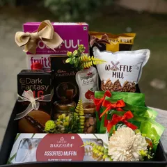 Show your employees you care with our wellness-focused hampers. This arrangement includes assorted muffins, healthy juices, premium dark chocolate, and other comforting treats. It's a thoughtful way to support your team's well being, whether for a get-well-soon gesture or an employee appreciation initiative.