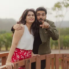 A fun, spontaneous moment on a wooden bridge. Capturing your unique personalities and the fun you have together is a key part of our process.