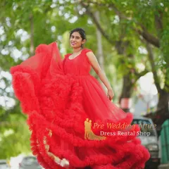 My bright red ruffled gown is a statement piece. The voluminous, textured ruffles add drama and movement, making it ideal for dynamic shots where you want the dress to be the star.