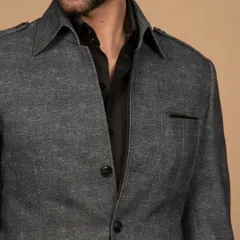 A close-up of my summer shacket in a textured grey fabric. It's the perfect blend of a shirt and a jacket, ideal for effortless summer layering and a casual chic look.