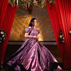 A stunning solo portrait of the bride-to-be, twirling in her magnificent purple engagement gown.
