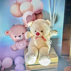 A detail shot of the teddy bear props used in a modern baby shower. The soft toys add a cuddly and sweet touch to the decor.